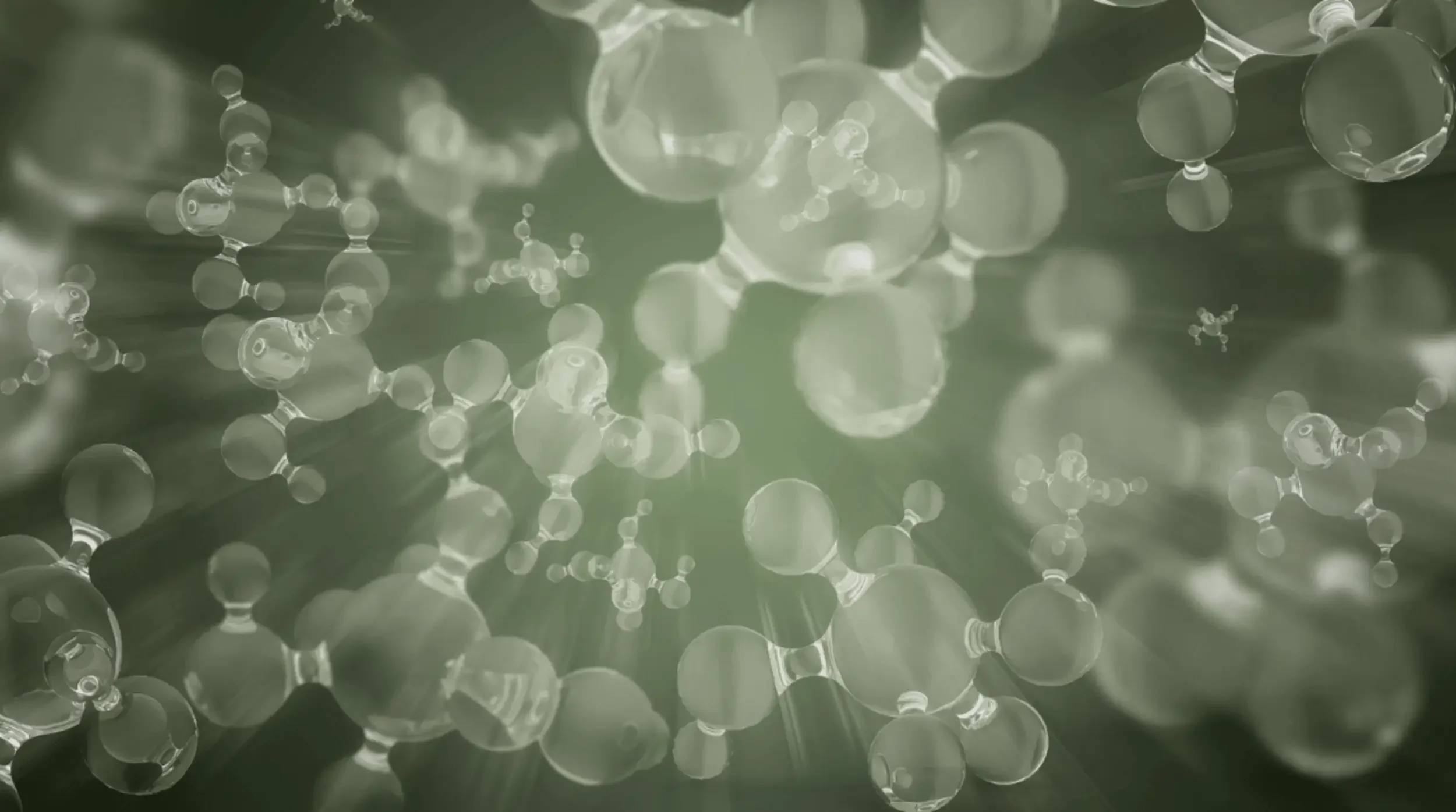 Clear molecular structures suspended in soft sage-green light, representing sound frequencies at a cellular level